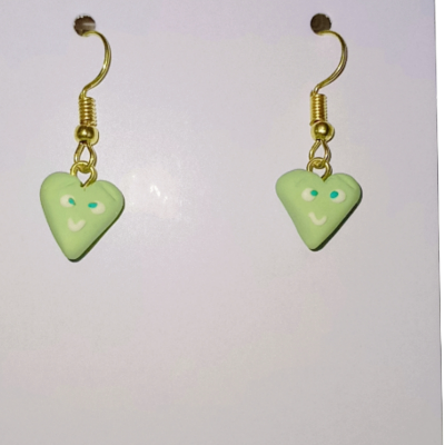 Hand made Polymer Clay earrings heart shape with smiley face on it